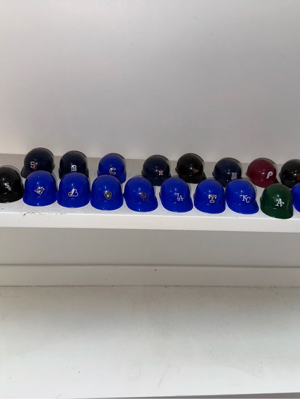 A collection of 22 Vintage Mini MLB Helmets